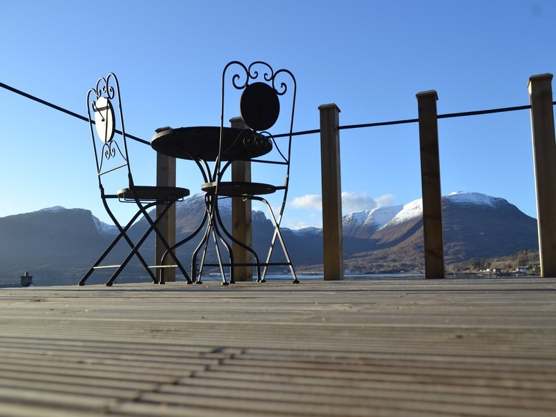 deck area and views over the snow capped applecross hills